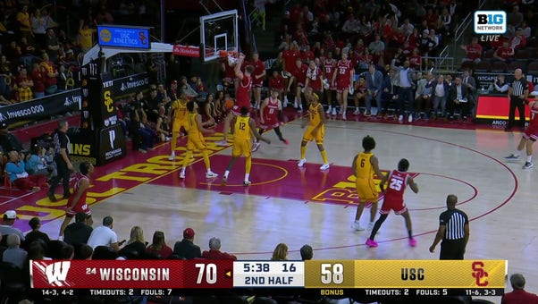 Nolan Winter cuts inside for the slam, extending Wisconsin's lead vs. USC