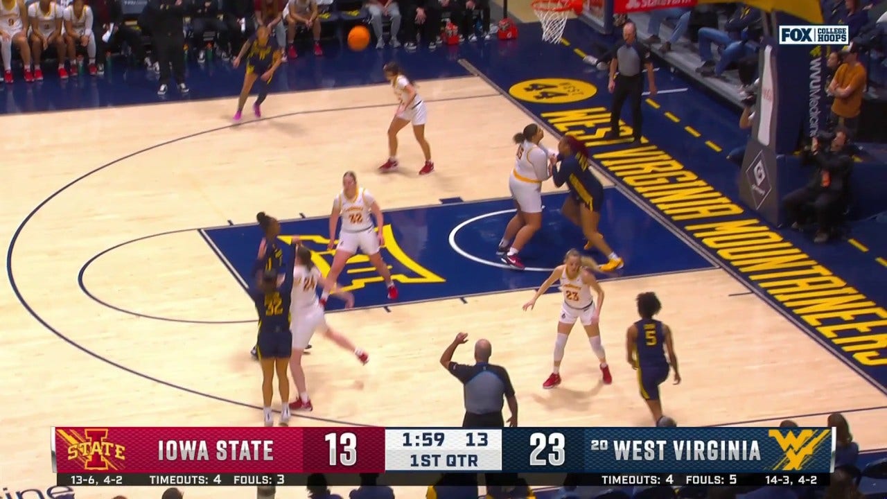 Kyah Watson hits a 3-pointer, extending West Virginia's lead over Iowa State