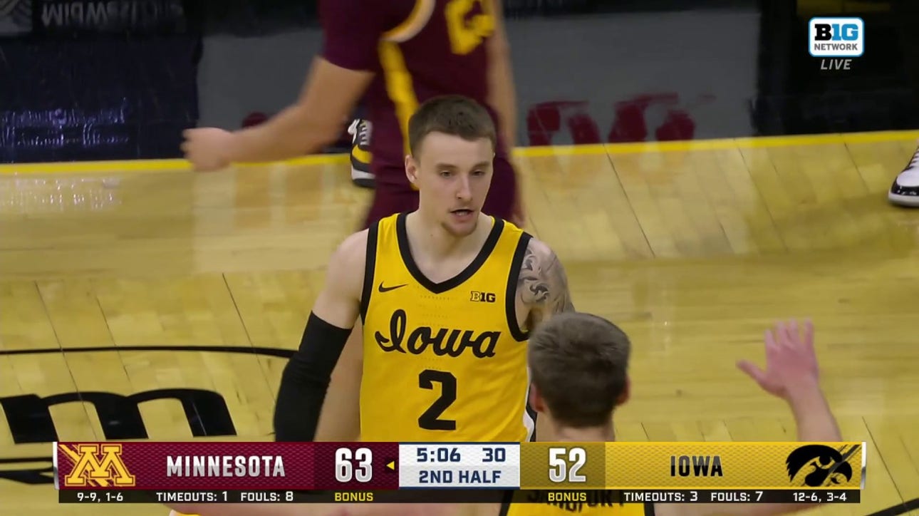 Iowa's Brock Harding gets the tough steal and finishes the layup to trim Minnesota's lead