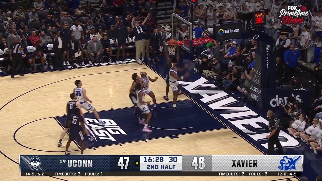 UConn's Samson Johnson flies in for the putback jam vs. Xavier