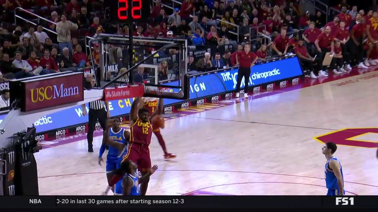 USC's Rashaun Agee throws down a two-handed dunk, trimming the UCLA lead