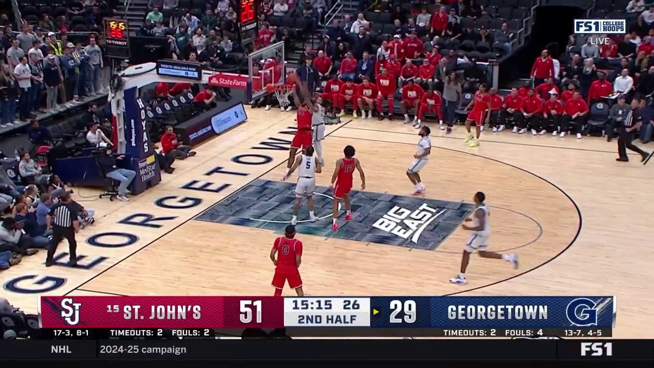 St. John's Zuby Ejiofor throws down a tough alley-oop dunk against Georgetown