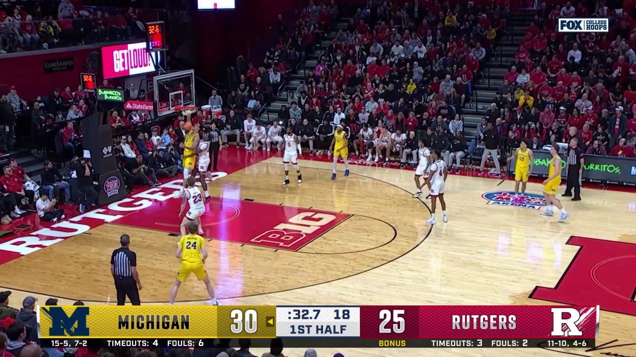 Vladislav Goldin hammers the one-handed jam, extending Michigan's lead over Rutgers