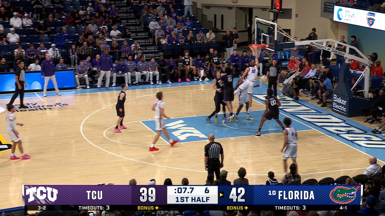 Thomas Haugh cuts inside for a one-handed slam, extending Florida's lead over TCU
