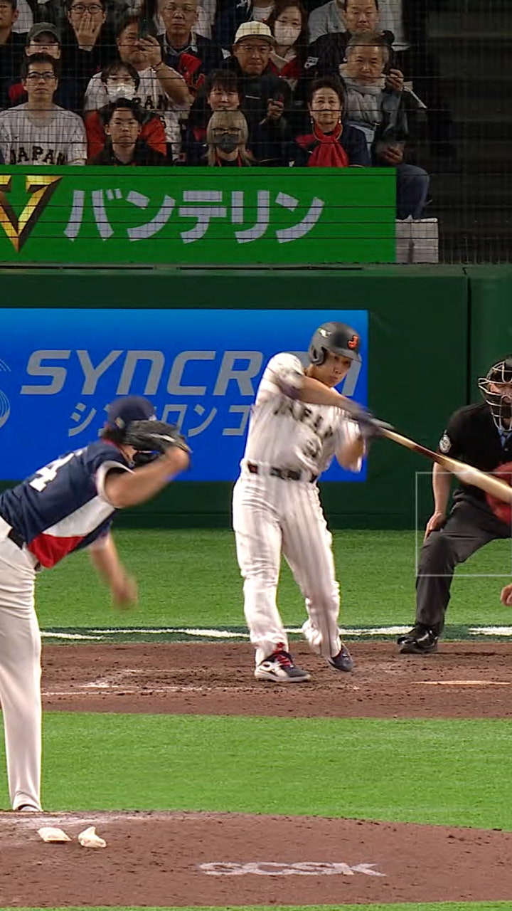 Japan's Masataka Yoshida hits single, driving in two runs