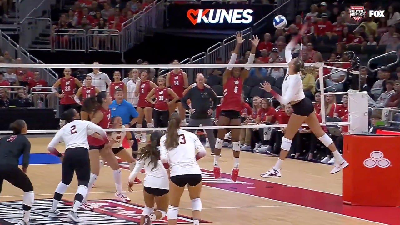 Stanford's Sami Francis rips a set and connects for the point against Wisconsin