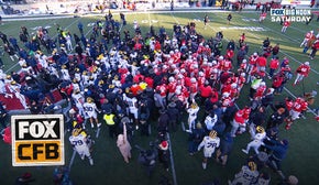 Massive SCUFFLE ensues after Michigan tries to plant flag on Ohio State's logo | FOX College Football