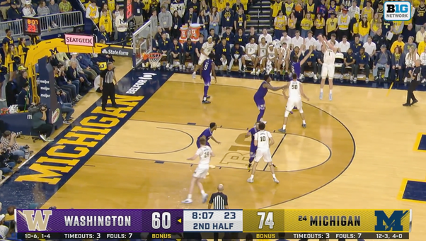 Danny Wolf DRAINS a tough three-pointer as Michigan leads 77-60 over Washington