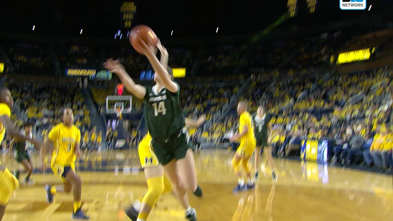 Michigan State's Grace VanSlooten draws foul and finishes the layup to take a lead over Michigan