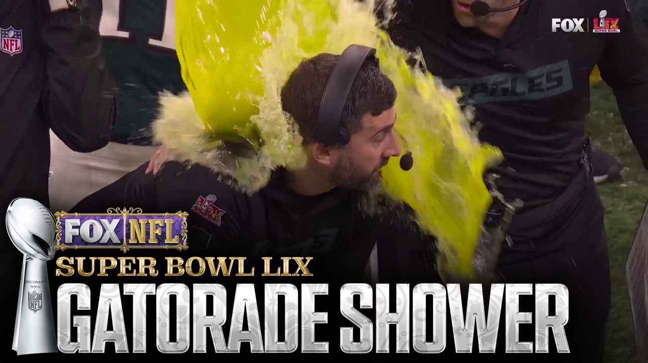 A.J. Brown and DeVonta Smith shower Nick Sirianni with Gatorade during Super Bowl LIX