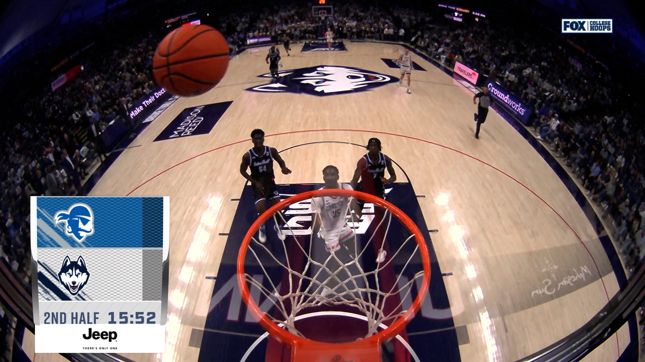 UConn's Hassan Diarra throws it off the glass to Samson Johnson for an UNREAL jam vs. Seton Hall