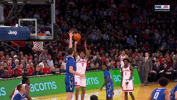 Creighton's Ryan Kalkbrenner delivers a vicious block against St. John's