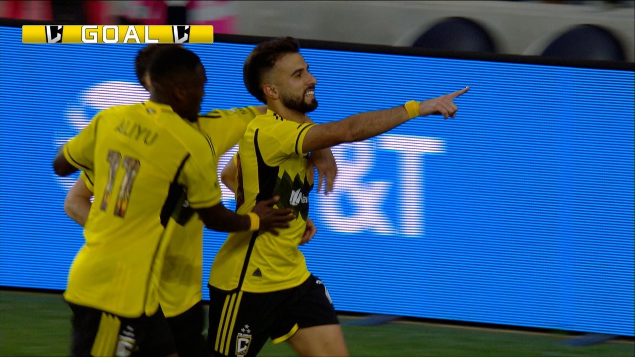 Diego Rossi scores on a penalty kick, leveling the score for Columbus against Cincinnati