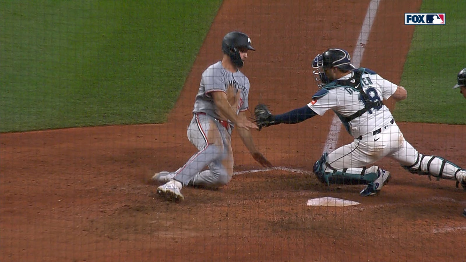 Mariners' Julio Rodriguez throws out Twins' Matt Wallner at home to keep game tied in extras