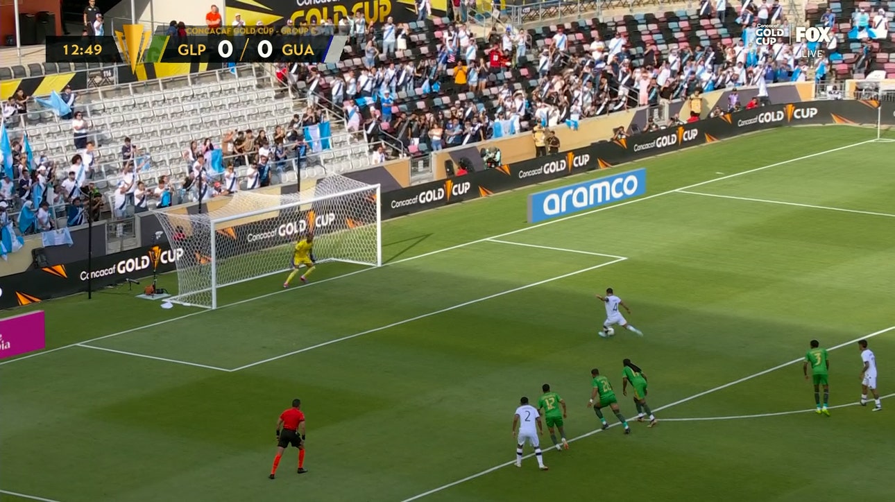 José Pinto converts the penalty giving Guatemala an early lead over Guadeloupe