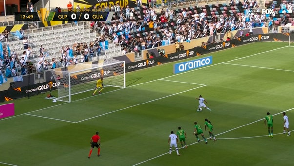 José Pinto converts the penalty giving Guatemala an early lead over Guadeloupe