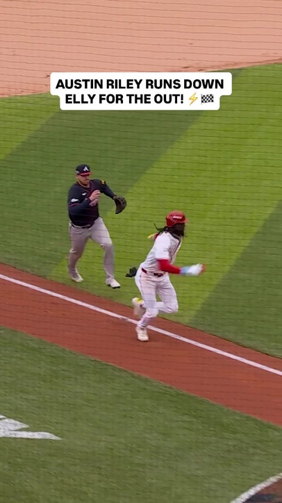 Braves Austin Riley chases down Reds' Elly De La Cruz for an out at the Speedway Classic