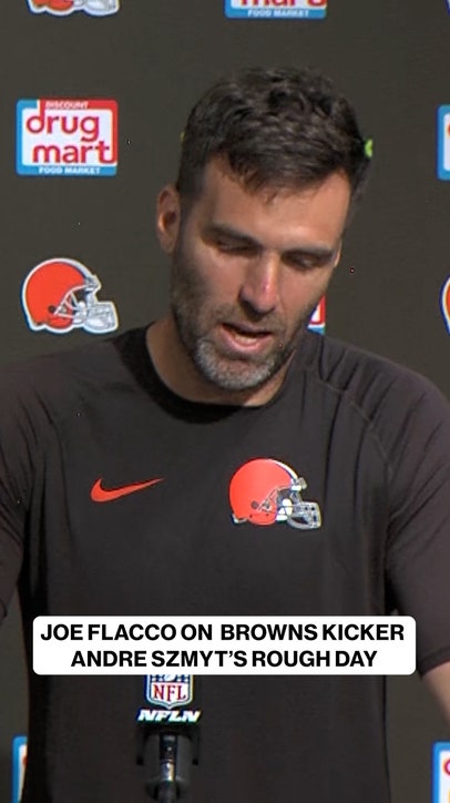 Joe Flacco giving good advice to Browns Kicker Andre Szmyt after tough day