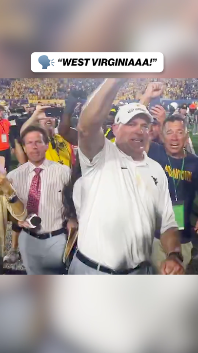 West Virginia head coach Rich Rodriguez was HYPED after OT win against Pitt!