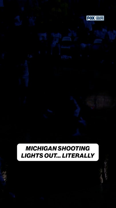 Michigan's Trey McKenney SCORES AND-1 when Crisler Center lights go out!