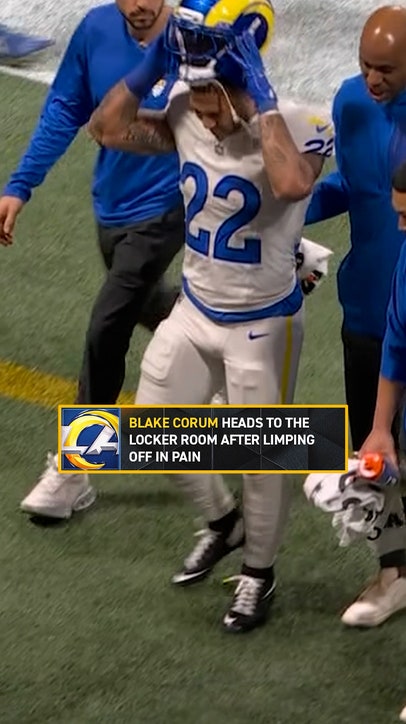 Blake Corum heads to the locker room after limping off in pain 