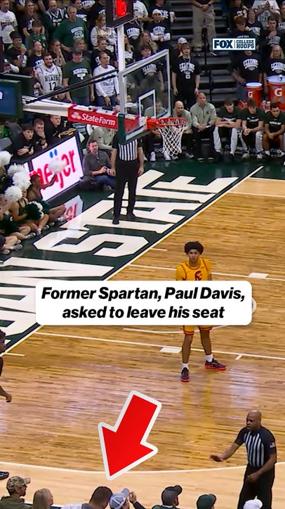 Odd moment in Michigan State-USC. After being consulted by the referee, it appears Tom Izzo asks former Spartan, Paul Davis, to leave his seat.