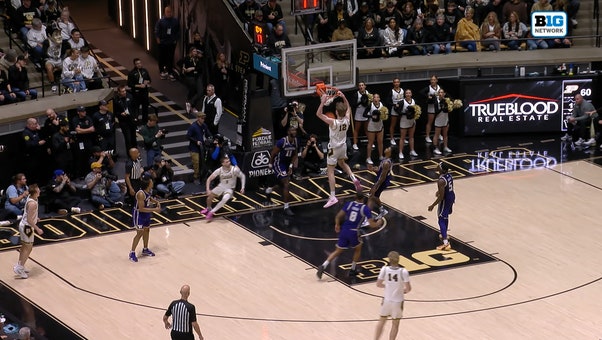 Braden Smith sets up Daniel Jacobsen for an alley-oop dunk again, extending Purdue's lead over Washington