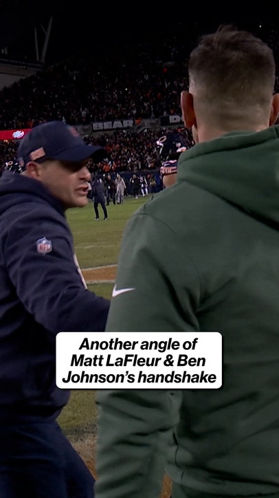 Ben Johnson gives Matt LaFleur a quick handshake before celebrating with his team