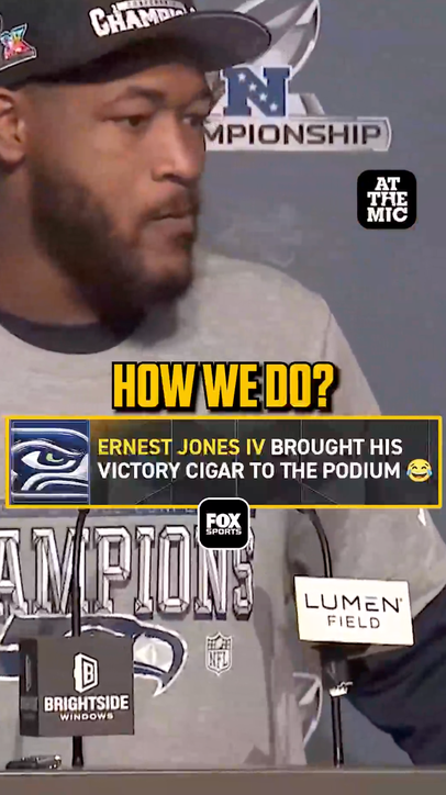 Ernest Jones walked to the press conference with a victory cigar in his hand