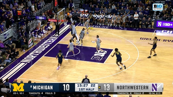 Arrinten Page's block sets up quick fastbreak layup by Angelo Ciaravino, extending Northwestern's lead over Michigan