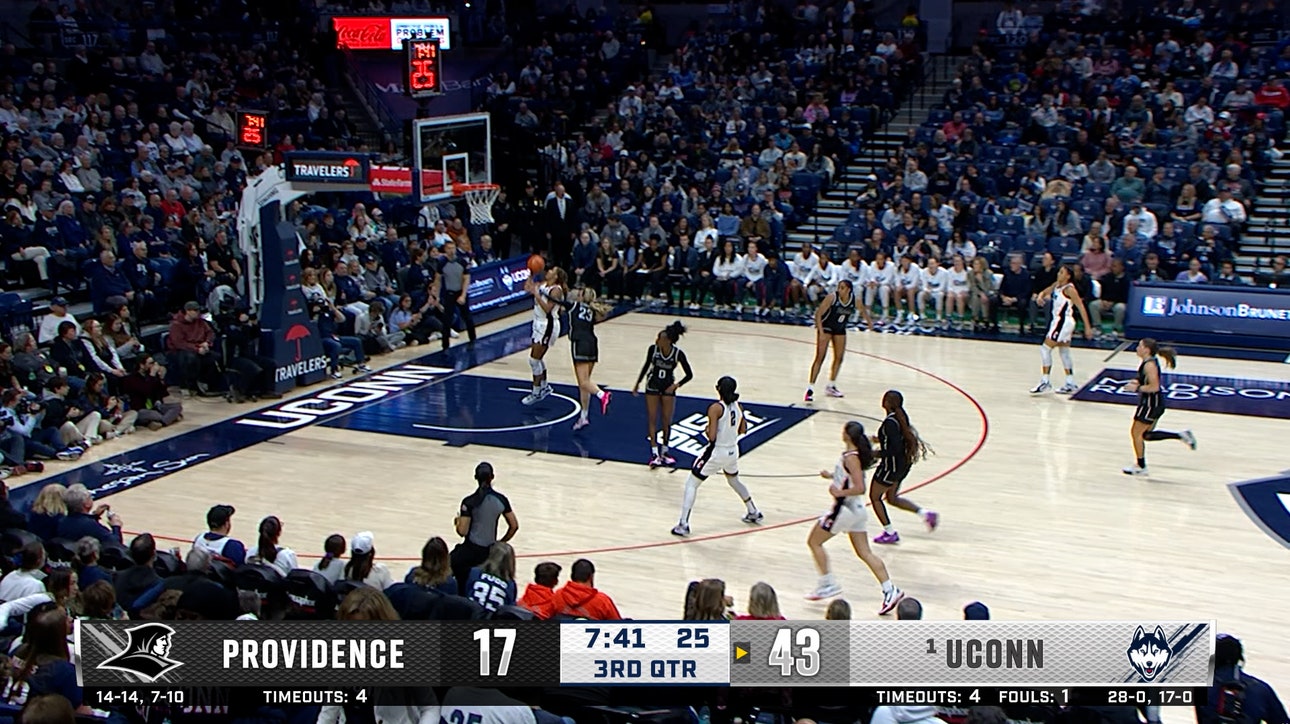 UConn's Sarah Strong forces the turnover and finishes the fast break vs. Providence