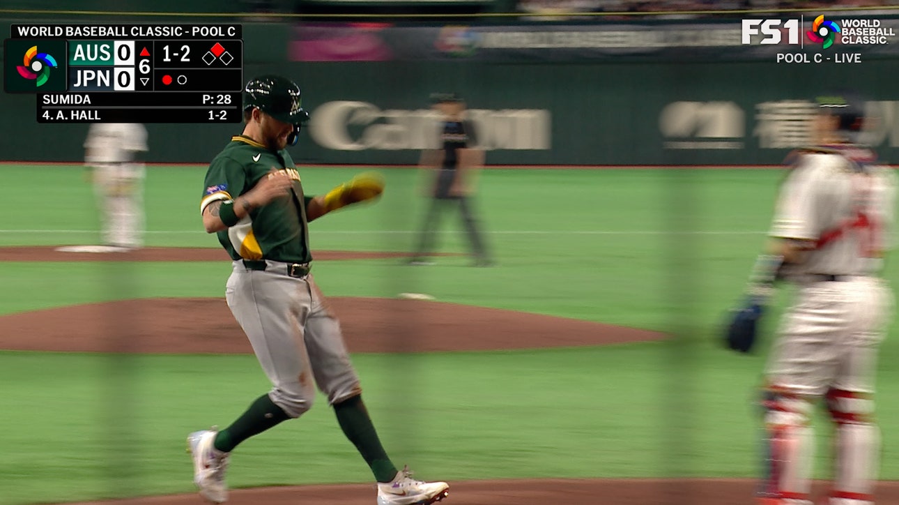 Australia’s Aaron Whitefield steals third and scores after Japan throwing error to take lead