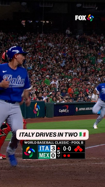 A two-run double adds to Italy’s lead
