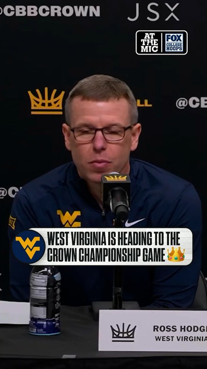 West Virginia HC Ross Hodge reacts after his team’s win over Creighton 