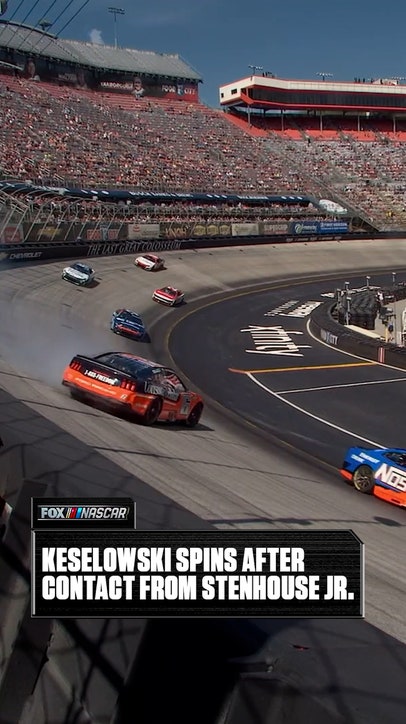 Brad Keselowski goes around after a bump from Ricky Stenhouse Jr.