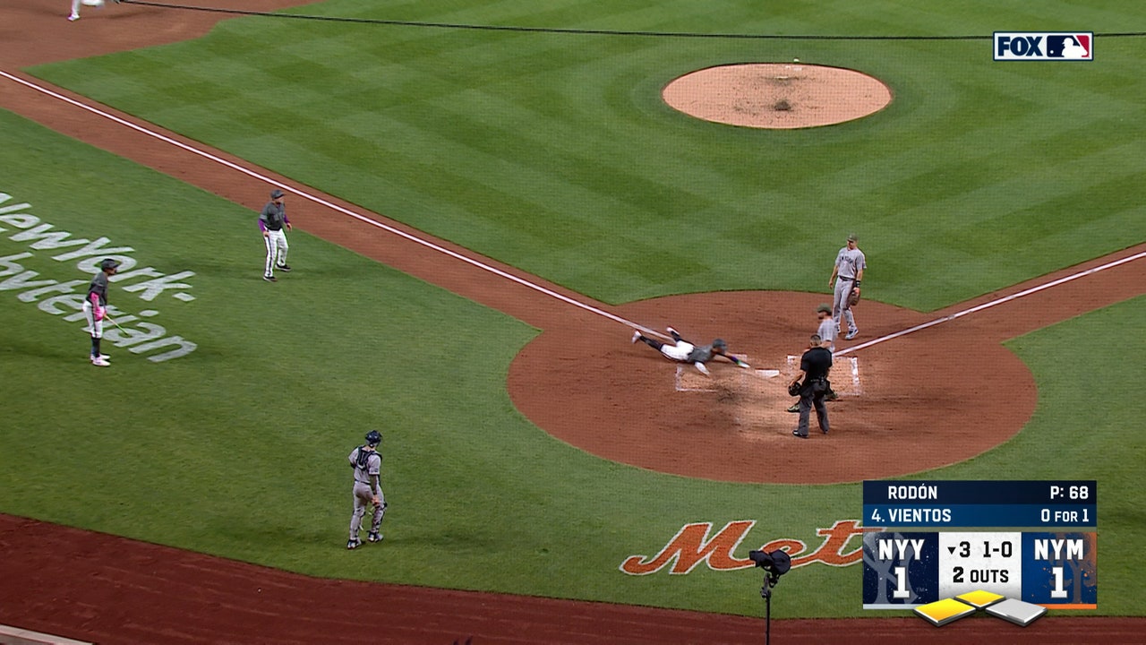 Mets score two runs off Carlos Rodón's wild pitch and error to pull ahead of Yankees