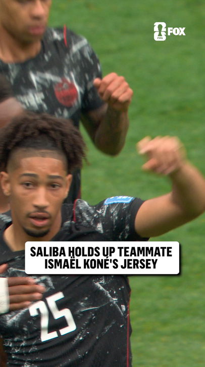 After scoring for Canada, Nathan Saliba held up Ismaël Koné's jersey