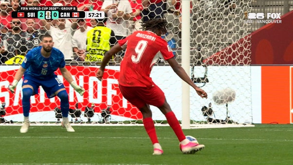 Johan Manzambi slots it home past the keeper to extend Switzerland's lead over Canada | 2026 FIFA World Cup™