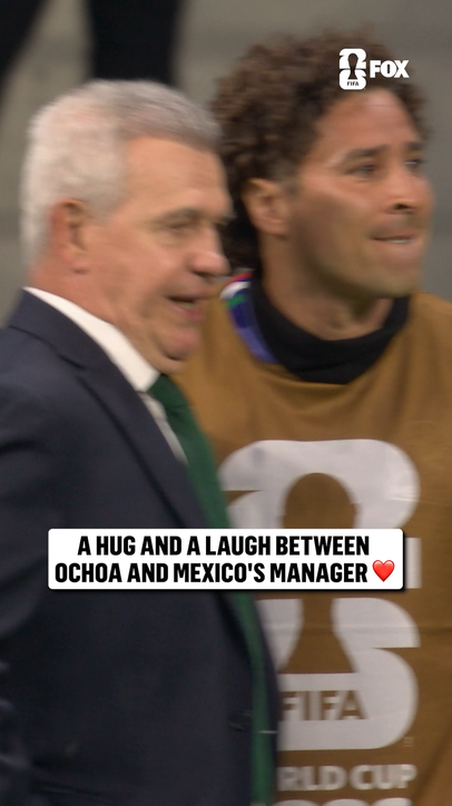 Mexico's legendary keeper Memo Ochoa and Javier Aguirre share a moment on the sideline