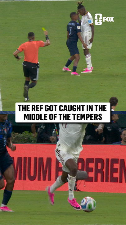 A heated interaction between Spain and Uruguay as the ref has to step in
