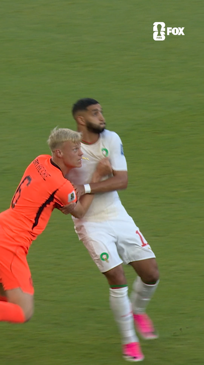 Morocco's Saibari and the Netherlands' Van Hecke going at it early in this Round of 32 match