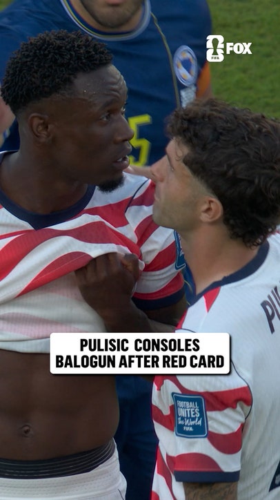 Christian Pulisic has a moment with Flo Balogun after he was shown a red card