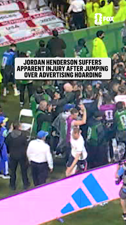 Jordan Henderson with apparent injury during postgame celebrations