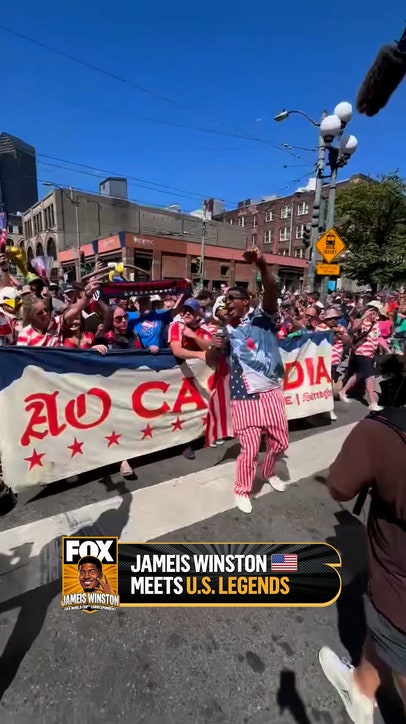 Jameis runs into USWNT legend Brandi Chastain while leading the USA march