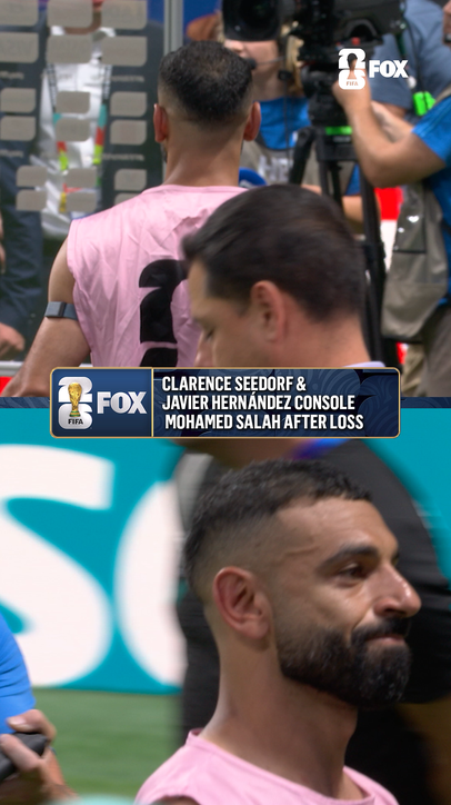 Egyptian captain Mo Salah shares a moment with Chicharito and Clarence Seedorf after the hard-fought match