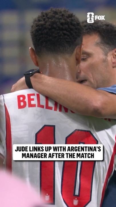 Jude Bellingham and Lionel Scaloni share an embrace after the match