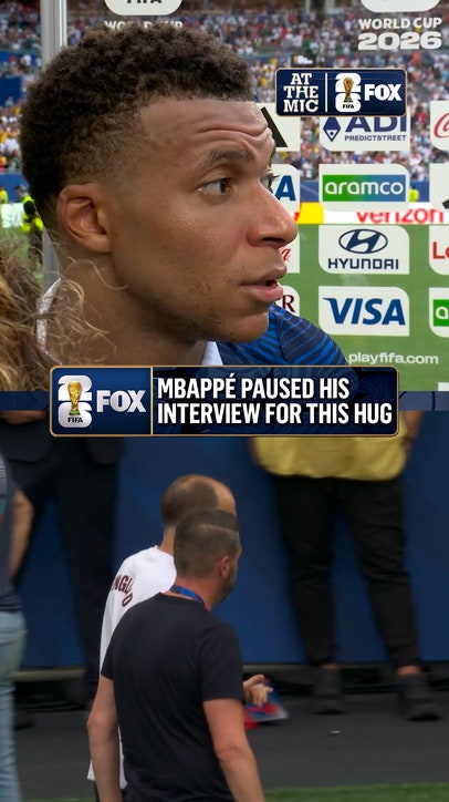 Kylian Mbappé shares a warm embrace with his former PSG manager, Thomas Tuchel, after England's victory over France
