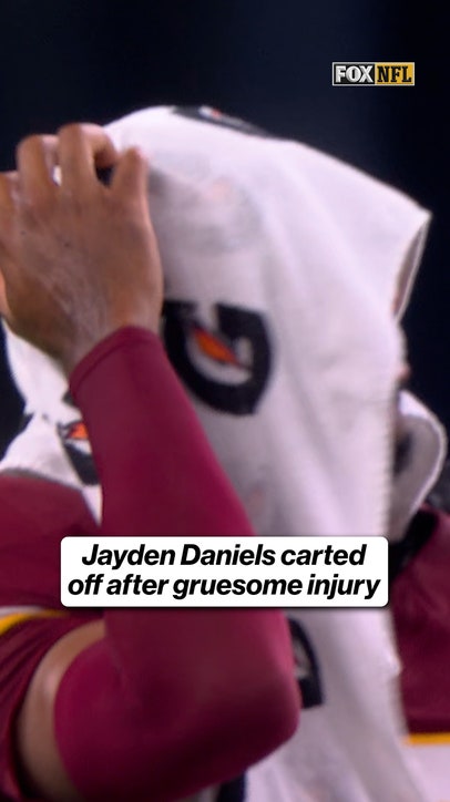 Jayden Daniels carted off after a gruesome injury