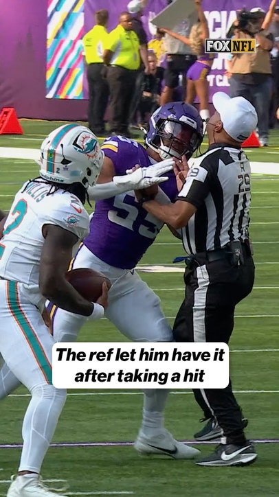 Adrian Hill was not happy after Vikings LB Eric Wilson ran into him