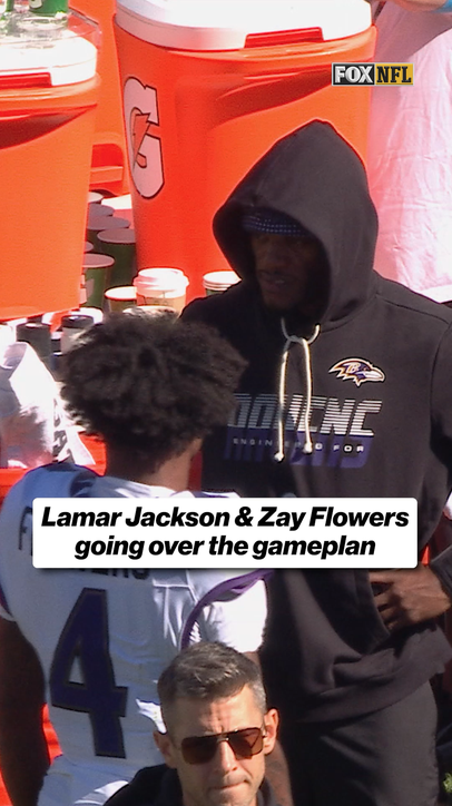 Lamar Jackson and Zay Flowers going over gameplan